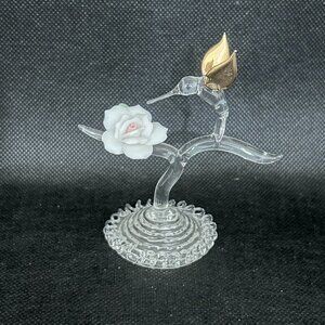 Hand blown glass hummingbird with porcelain rose figurine